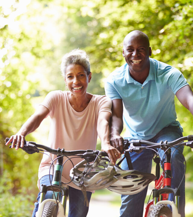 Mature,African,American,Couple,On,Cycle,Ride,In,Countryside